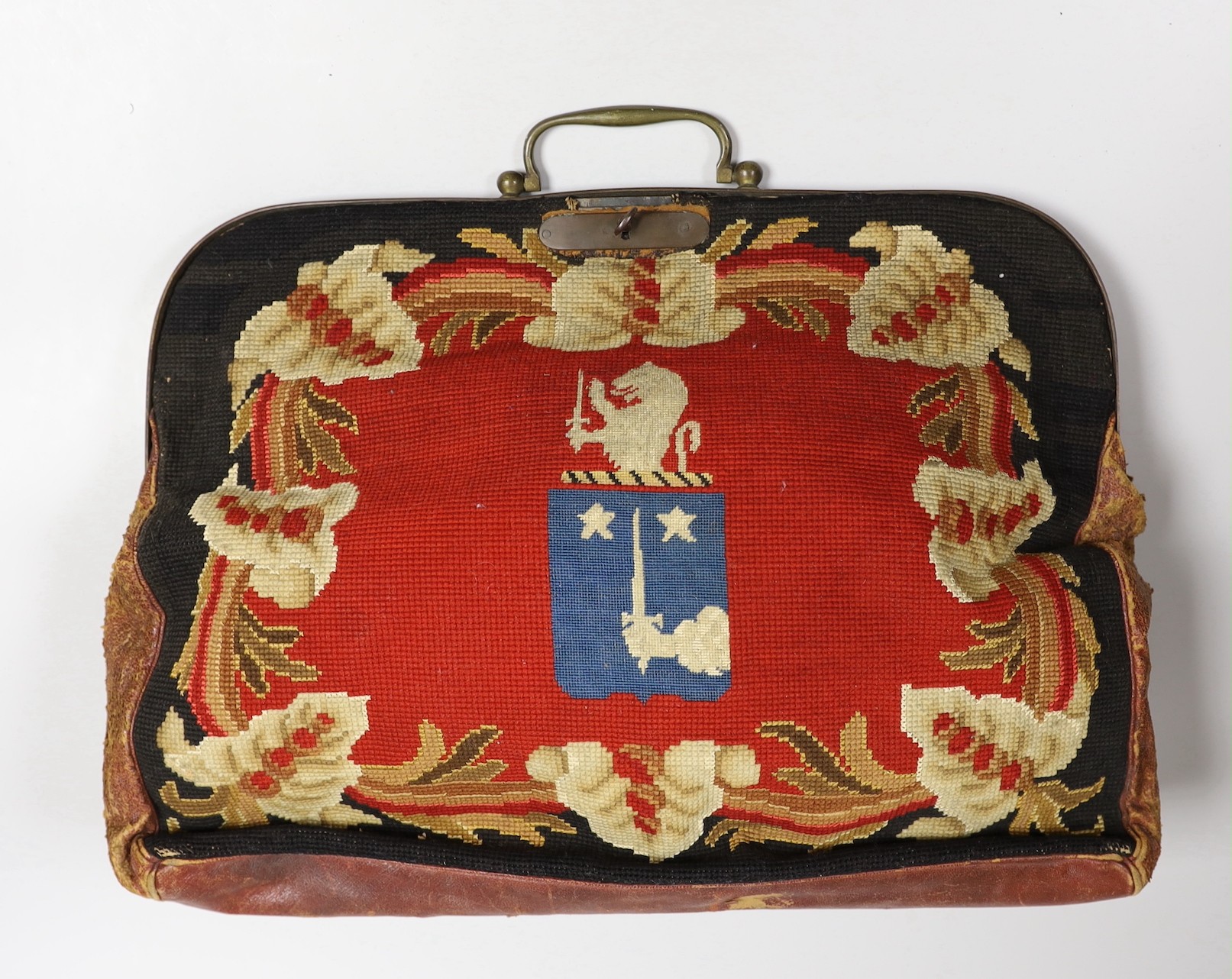 A 19th century needlework and leather bag and a leather Gladstone bag, needlework bag frame 40cms wide